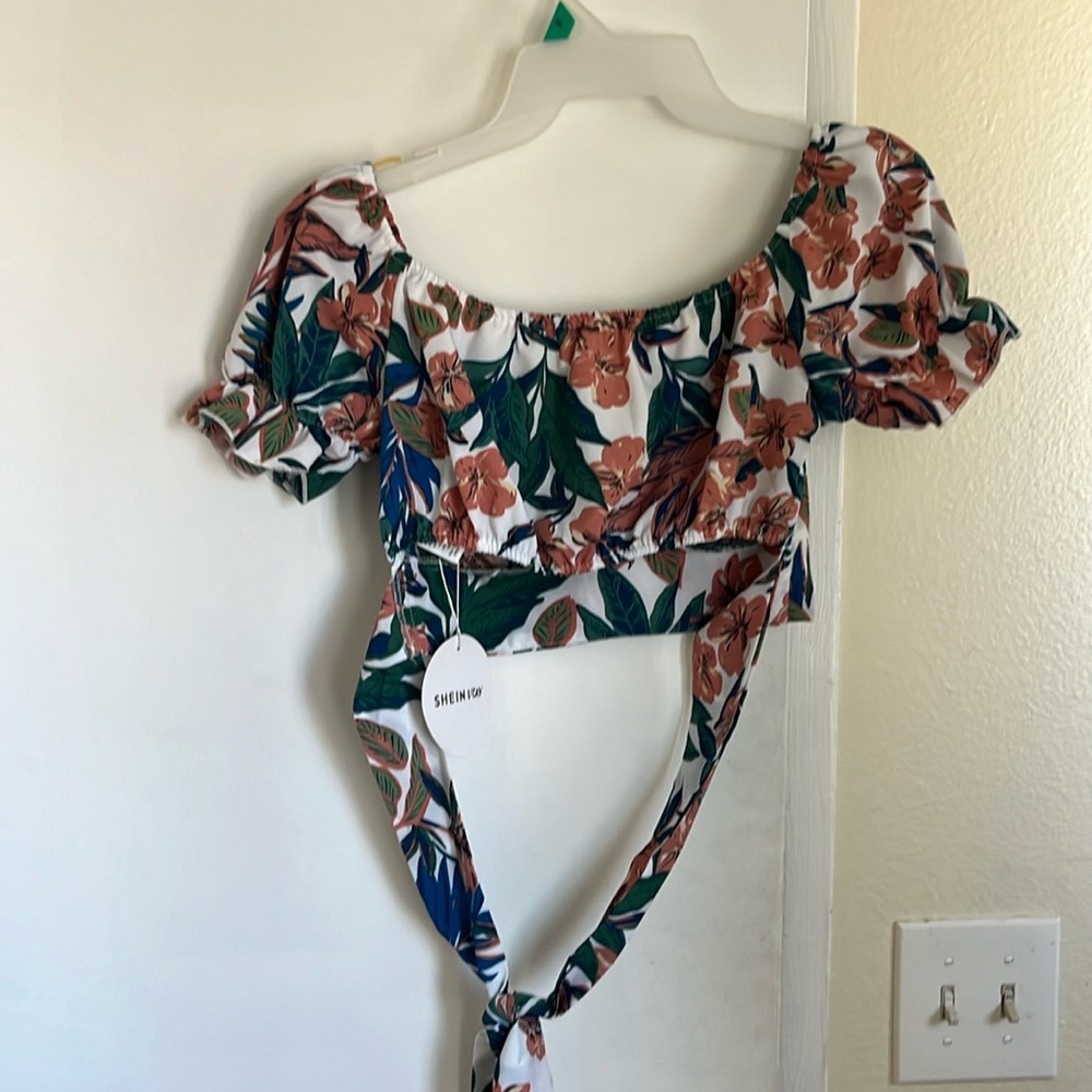 Never worn cute midriff shirt with a cute tie in the back. - Picture 1 of 8